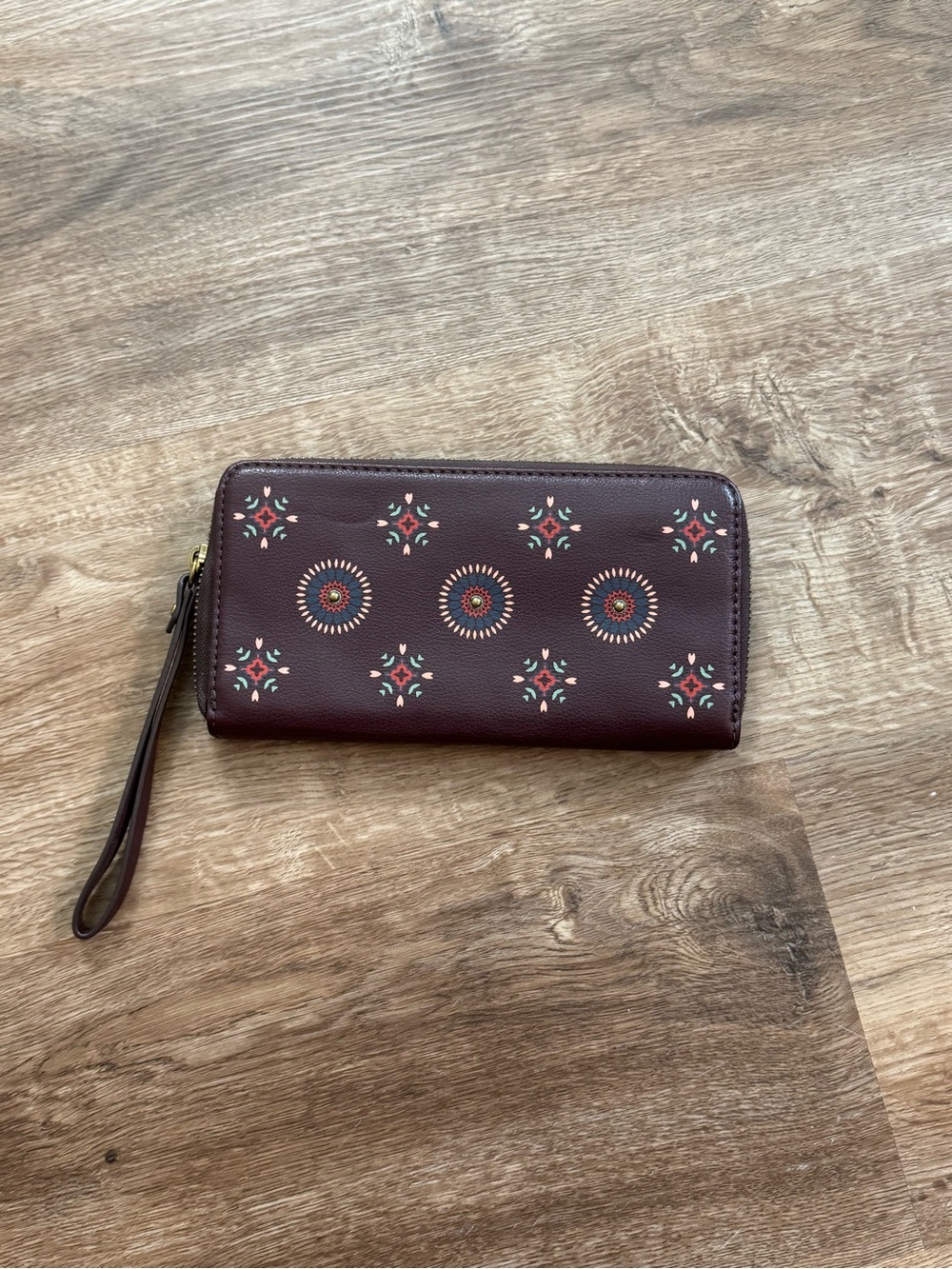 Fossil Burgundy Zip-Around Wallet with Floral Medallions